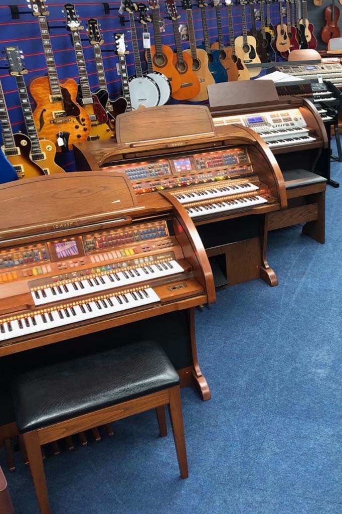 Allens Music Centre with Organs and guitars